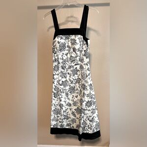 Cream and black floral A-line midi dress with adjustable straps and back zip